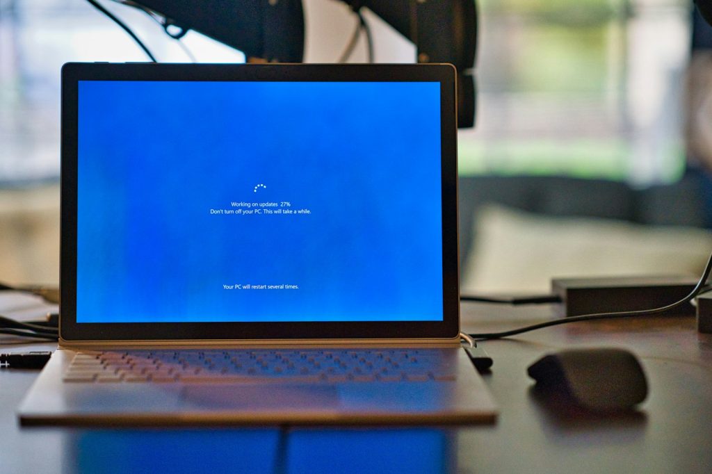 macbook pro on brown wooden table, pc-support, 